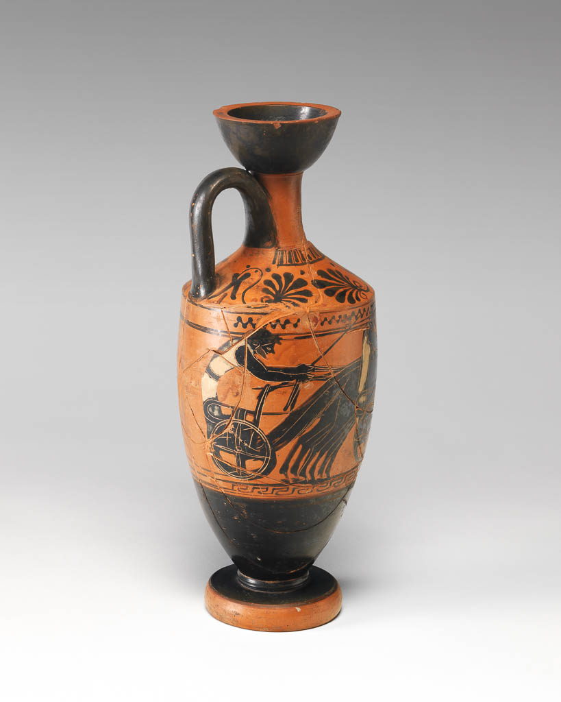 An image of Vessel. Lekythos. Chariot-race. Production Place: Attica, Athens. Clay, black-figured, height 0.315 m, width 0.126 m, 500-490 B.C. Archaic Period.