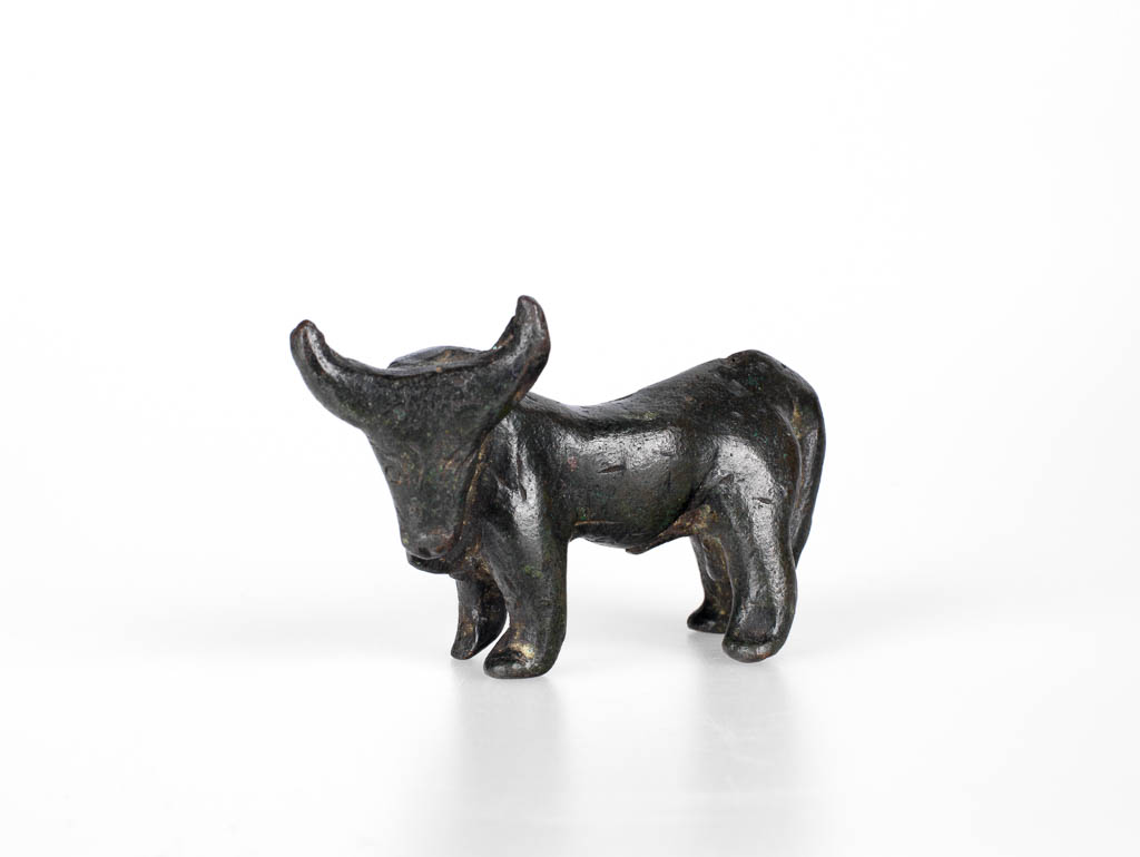 An image of Figurine of a bull, Greek. Copper alloy, height 0.05 m, length 0.087 m, 600-501 B.C. Field Collection: Cesme, Ionia, Turkey. East Greece.