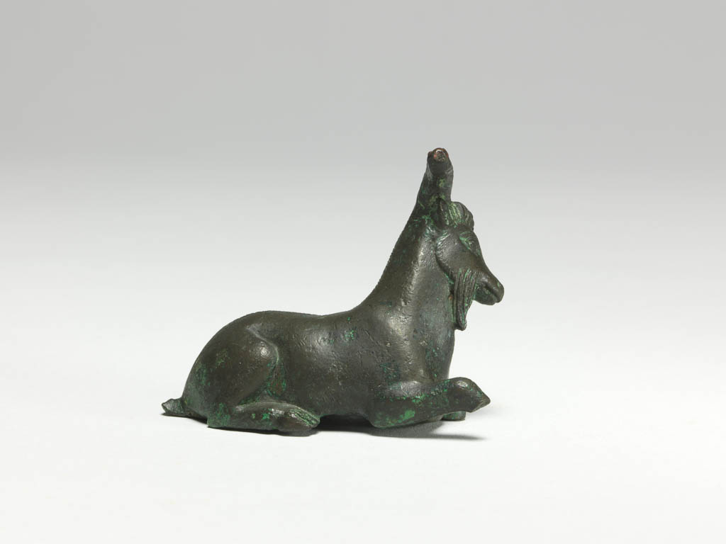 An image of Figure/Statuette. Goat. Production Place: Corinth, possibly. Bronze, height 0.047 m, width, 0.061 m, depth 0.048 m, maximum, 500-401 B.C. Classical Period.