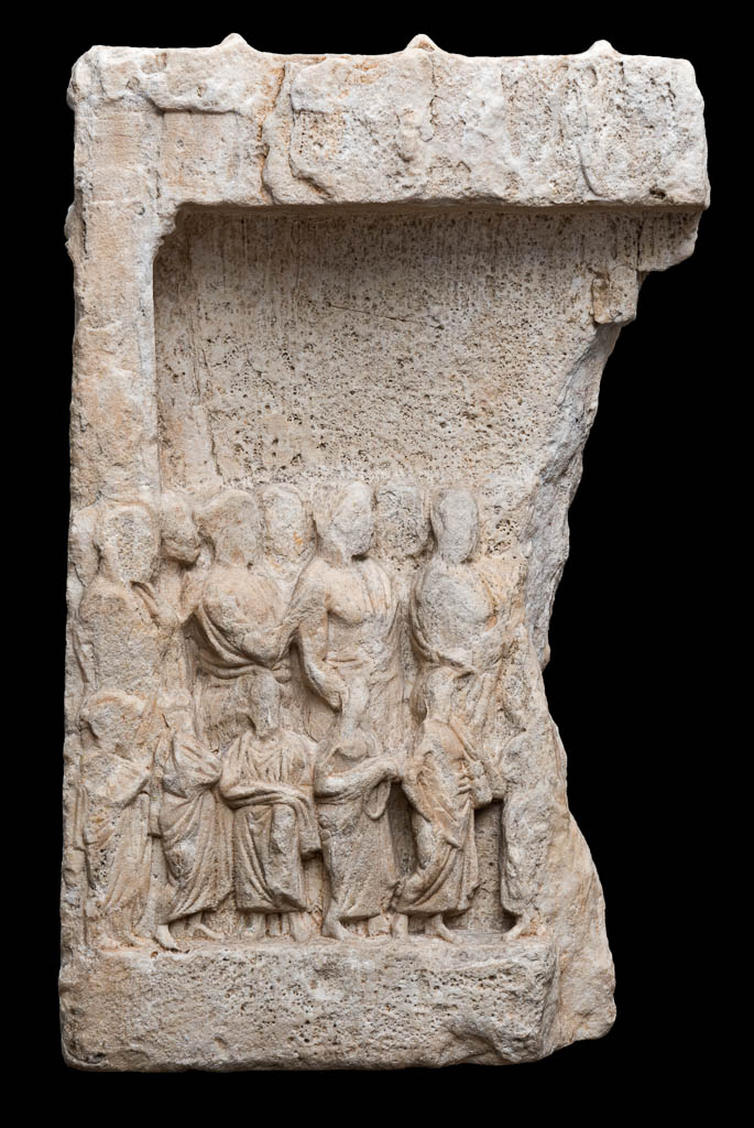 An image of Architectural element. Votive relief, with three rows of dedicants or votaries. Find Spot: Athens. Marble (Pentelic), carved, height 0.575 m, width 0.36 m, depth 0.15 m, approx, weight 40 kg, 400-301 B.C. Classical Period. Attic.