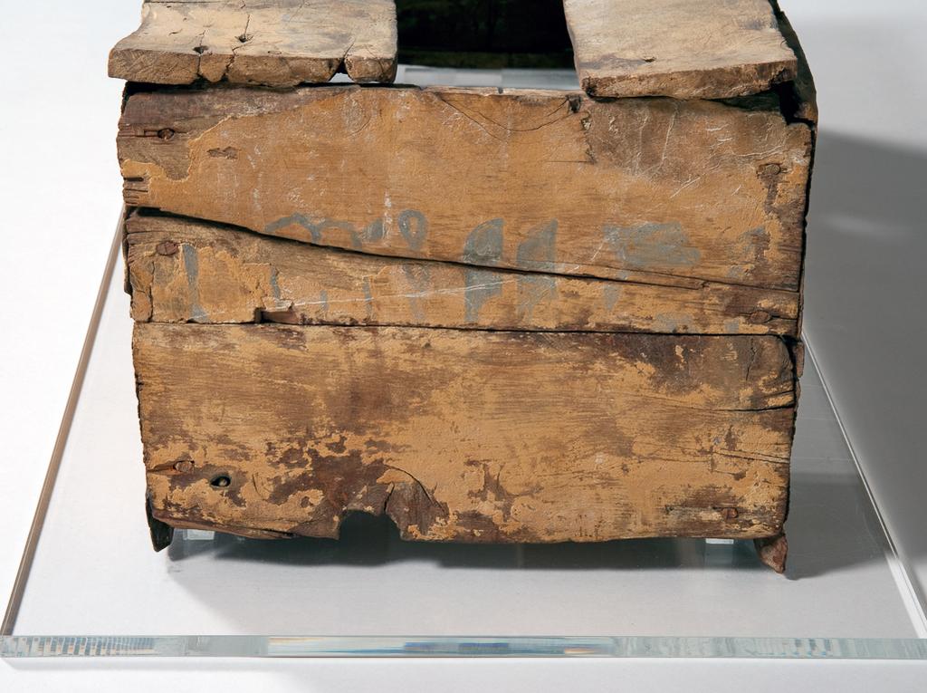 An image of Funerary equipment. Coffin. This dog was given his own tomb and is named in the coffin text five times. His names was 'Heb'. Production Place: Egypt. Find Spot: Beni Hasan. Wood, height 21 cm, length 70 cm, width 27 cm. Eleventh Dynasty; Twelfth Dynasty; Middle Kingdom, 2119-1794 B.C.