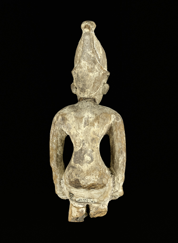 An image of Figure/Statuette. King, seated, wearing double crown. Production Place: Egypt. Wood with bronze uraeus, length 0.085 m.