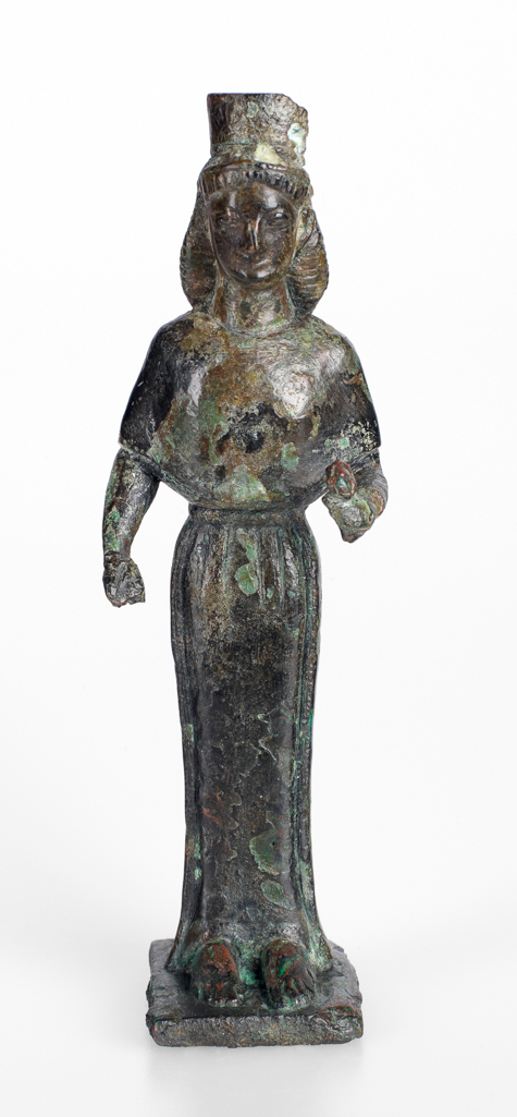 An image of Figure/Statuette of a woman, possibly Hera. Copper alloy, cast, height 0.135 m, width 0.041 m, depth (plinth) 0.034 m, 600-501 B.C. Production Place: Possibly Attica, Greece. Archaic Period.
