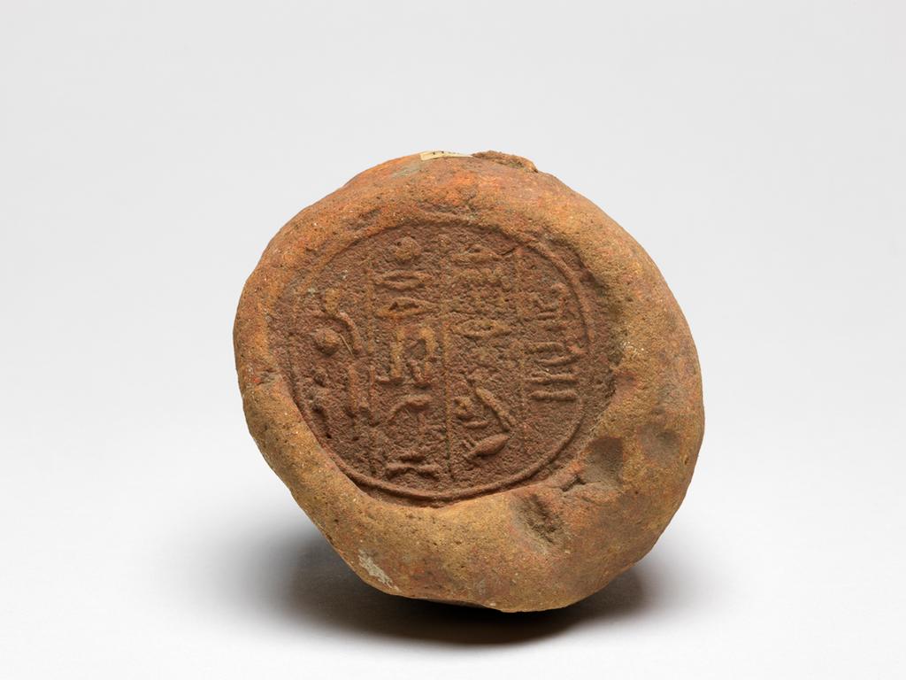 An image of Funerary equipment. Funerary cone fragment. Production Place/Find Spot: Egypt. Length 7 cm, diameter 7.5 cm. New Kingdom Period.