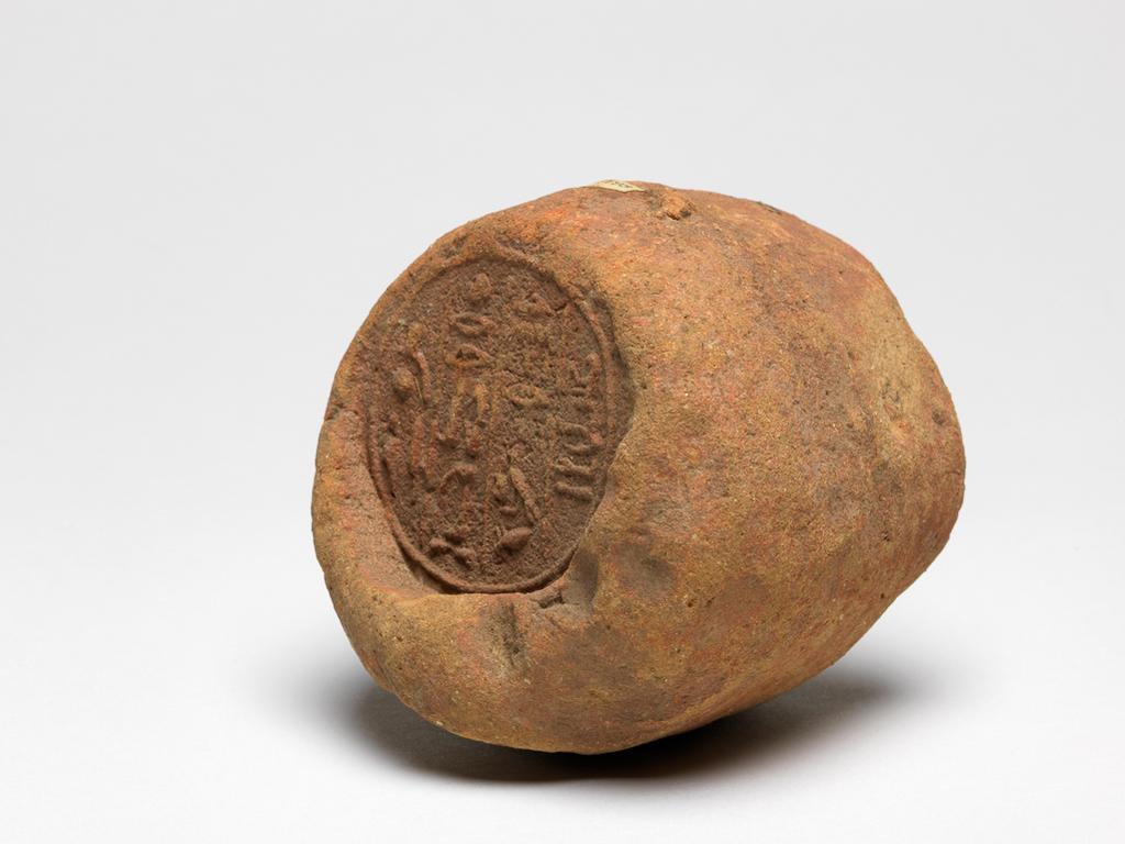 An image of Funerary equipment. Funerary cone fragment. Production Place/Find Spot: Egypt. Length 7 cm, diameter 7.5 cm. New Kingdom Period.