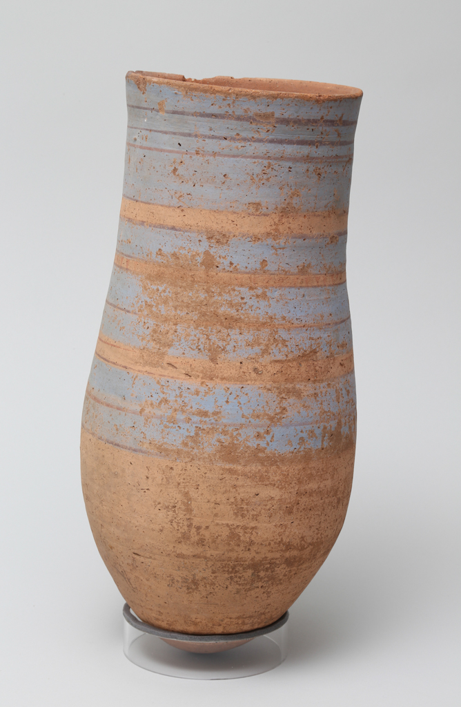 An image of Vessel. Necked jar, with 4 bands of blue and 12 lines of red decoration. Production Place: Egypt. Find Spot: Abydos ? Egypt. Height 0.35 m.