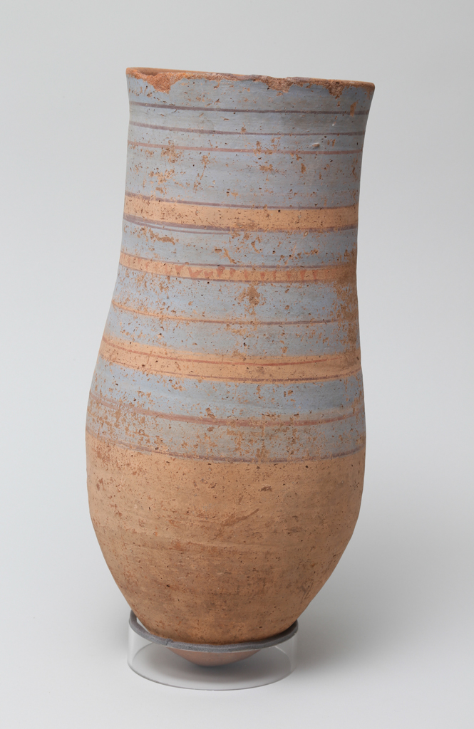 An image of Vessel. Necked jar, with 4 bands of blue and 12 lines of red decoration. Production Place: Egypt. Find Spot: Abydos ? Egypt. Height 0.35 m.