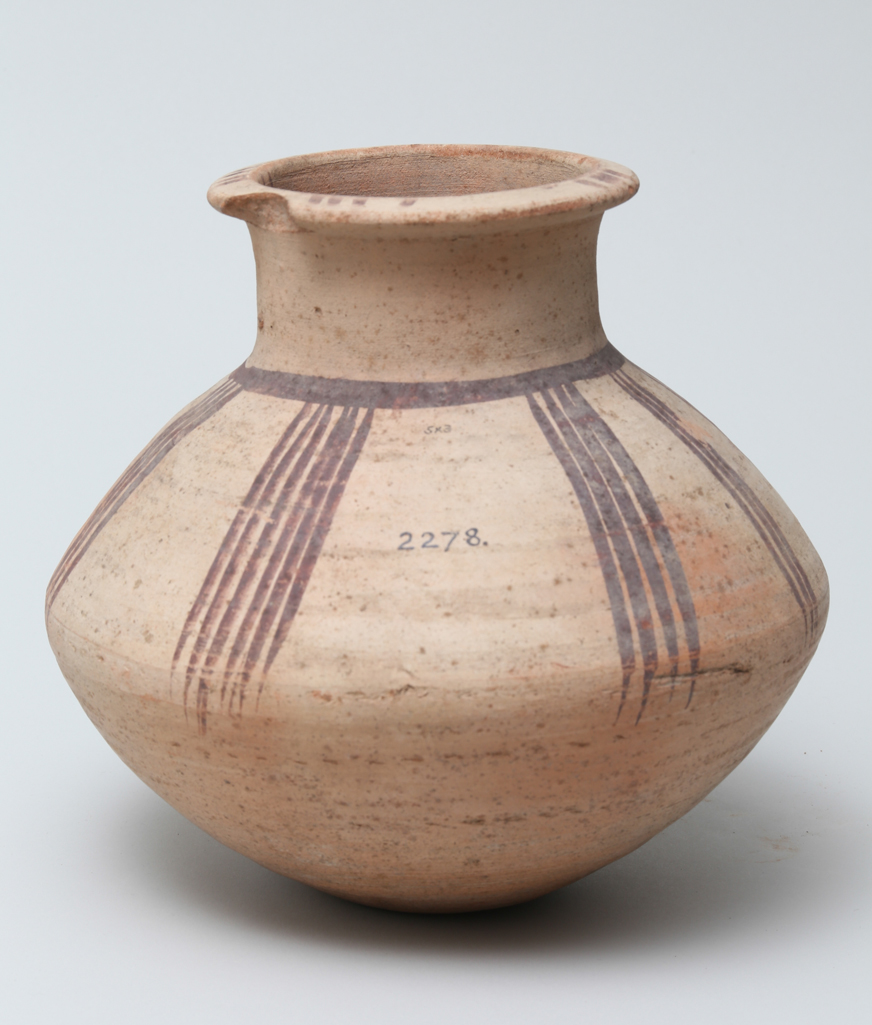 An image of Vessel. Jar, carinated, with line decoration in brown. Production Place/Find Spot: Egypt. Height 0.195 m. Eighteenth Dynasty. New Kingdom.