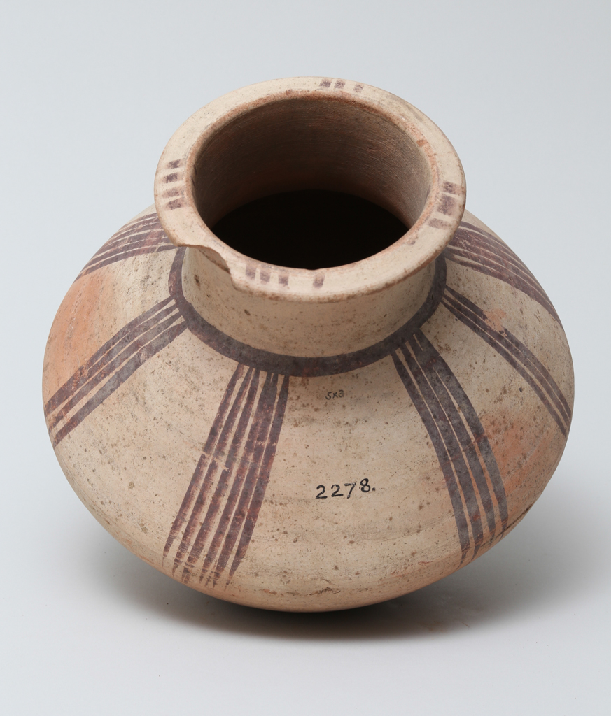 An image of Vessel. Jar, carinated, with line decoration in brown. Production Place/Find Spot: Egypt. Height 0.195 m. Eighteenth Dynasty. New Kingdom.