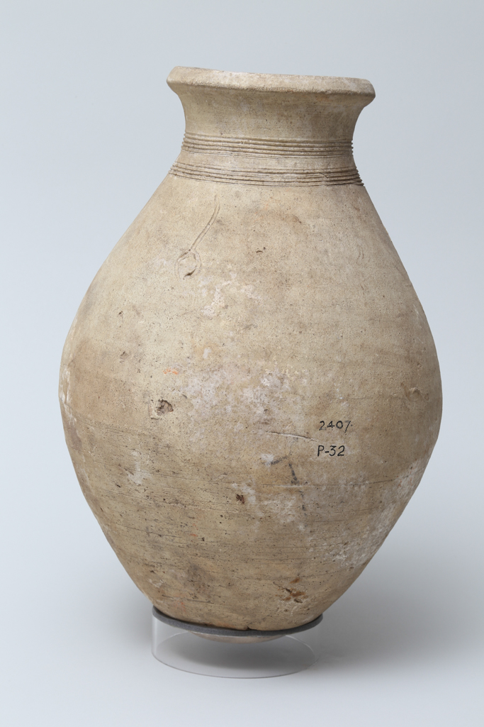 An image of Vessel. Flask, with 2 bands of decoration around neck and 2 pot marks. Production Place/Find Spot: Egypt. Height 0.31 m. Eighteenth Dynasty. New Kingdom.