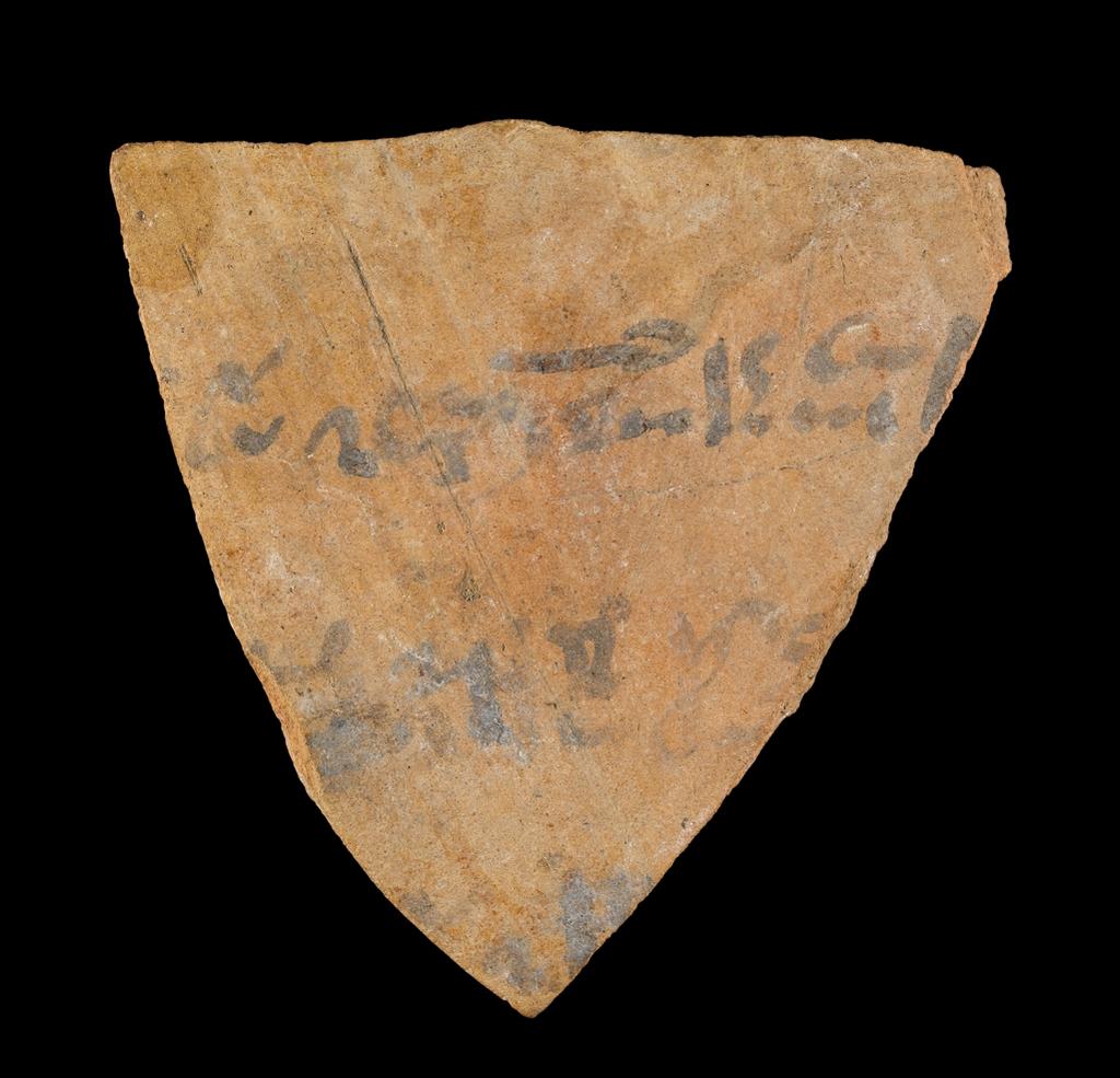 An image of Written Document. Ostracon. Production Place/Find Spot: Egypt. Fragment of jar, with 3 lines of hieratic text in black ink. Depth 0.01 mlength 0.072 m, width 0.057 m.