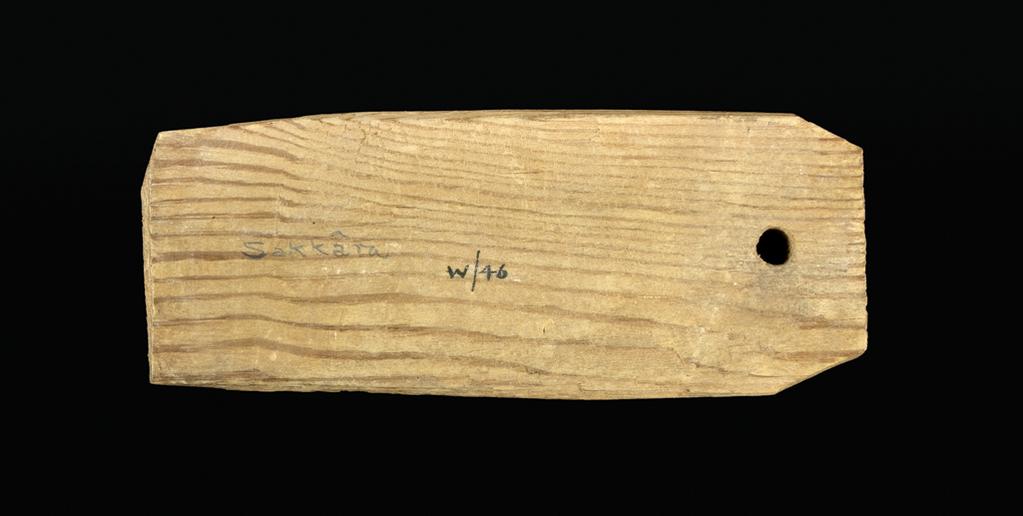 An image of Written document. Mummy label, Greek. Production Place: Egypt. Find Spot: Saqqara. Wood, length 0.12 m, width 0.05 m, 101-300. Middle Roman period.