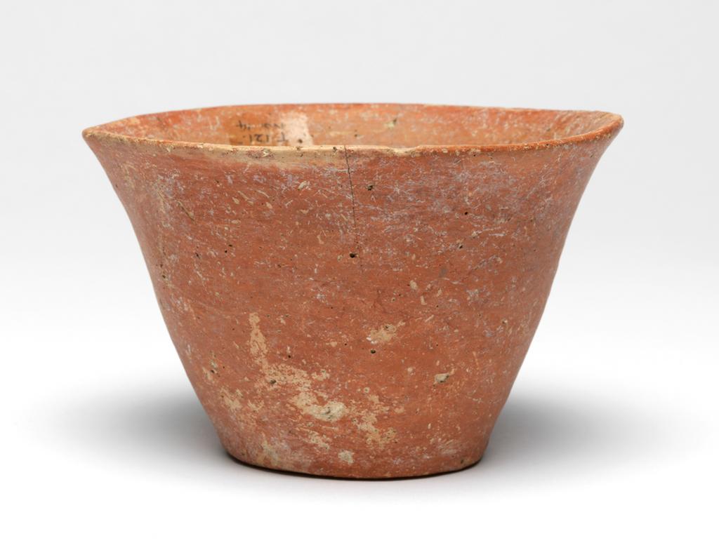An image of Vessel. Mug.  Production Place: Cyprus. Find Spot: Vounous Cyprus; Tomb 121. Clay, red-polished ware, height 0.077 m, width 0.121 m, 2200 to 2101 B.C. Early Cypriot II. Bronze Age.