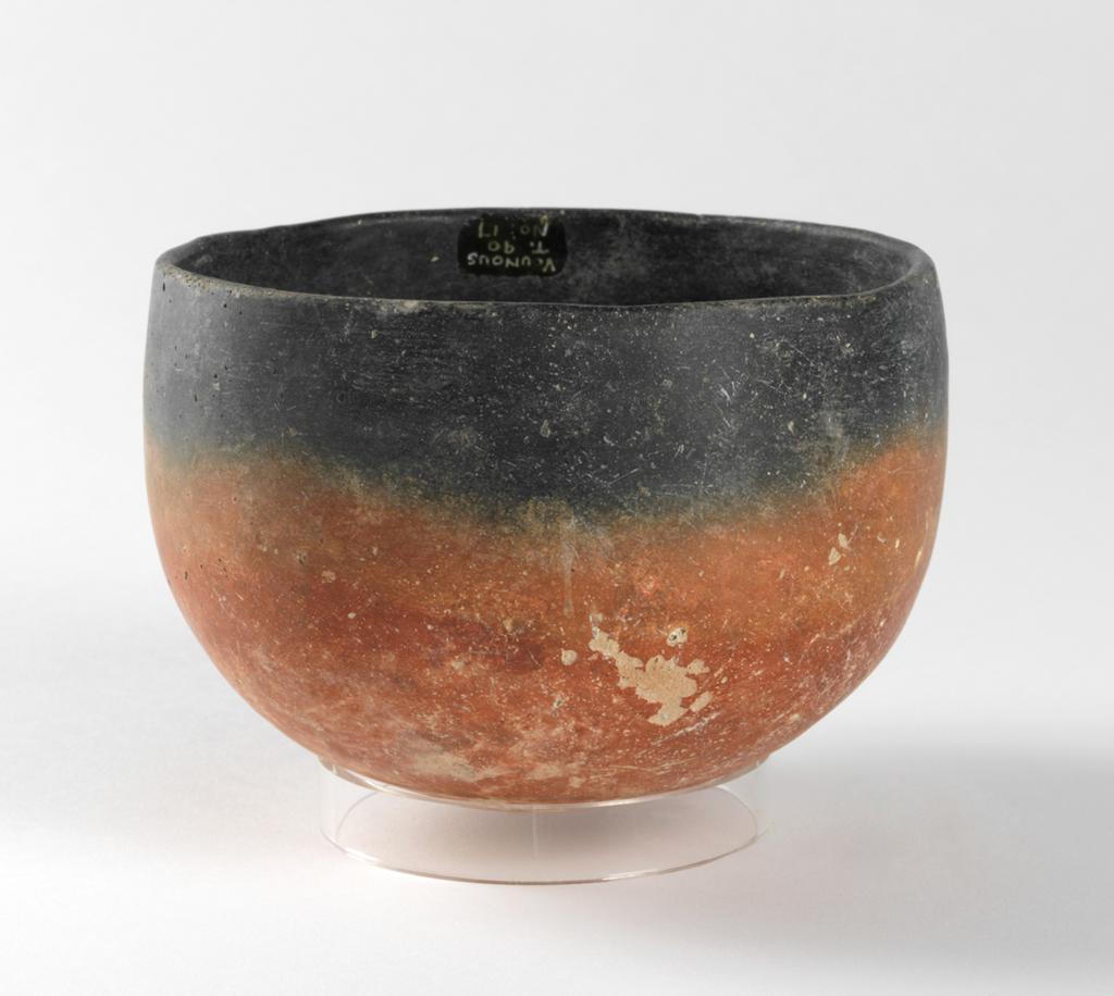 An image of Vessel. Horn-lug jar. Production Place: Cyprus. Find Spot: Vounous Cyprus; Tomb 90. Clay, red-polished ware, diameter 0.131 m, height 0.094 m, width 0.159 m, 2400 to 2201 B.C. Early Cypriot I. Bronze Age.