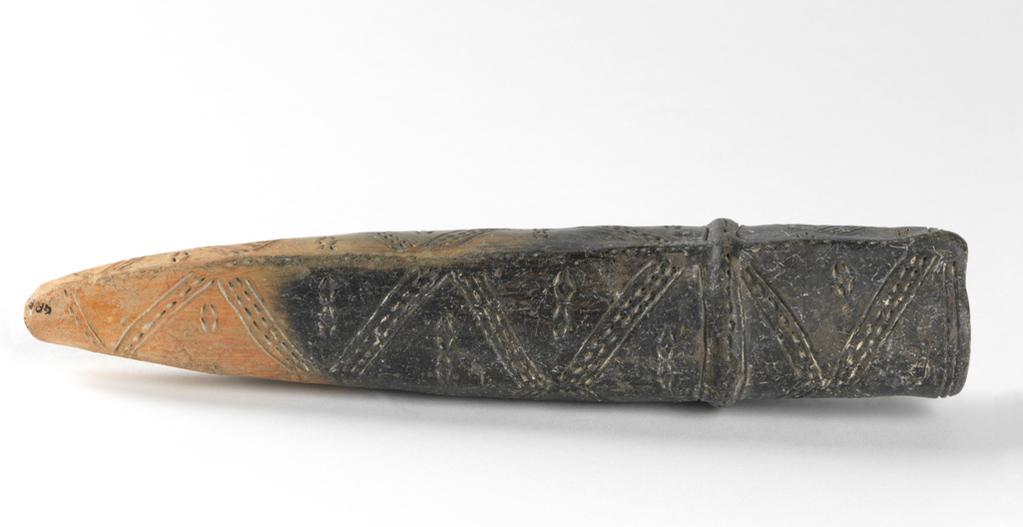 An image of Model of dagger scabbard. Production Place: Cyprus. Find Spot: Vounous Cyprus; Tomb 145. Clay, black surface, height 0.234 m, width 0.053 m, 2200 to 2101 B.C. Early Cypriot II. Bronze Age.