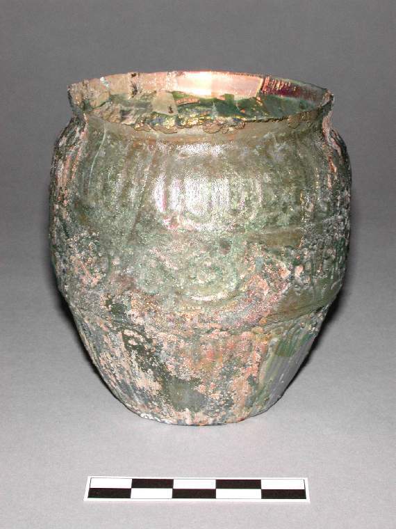 An image of Vessel/ Jar. Glass, mould pressed, AD 1-100. Early Roman Period. Find Spot: Tremithos, Cyprus. Production Place: Eastern Mediterranean. http://data.fitzmuseum.cam.ac.uk/id/object/65859