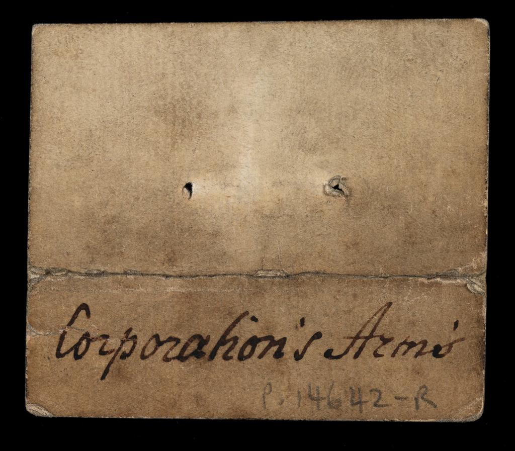 An image of Fragment of the Queen of Spades. Upper half of the card. The Queen faces left and the pip is located at upper right. The figure holds a yellow rose in her left hand. There is a crease across the card where it has been folded. A handwritten inscription on the verso in black ink: ‘Corporation’s Arms’.’ There are two holes at upper centre, which are most likely stitching holes relating to the secondary use of the card as a stiffening material for bookbinding. Hand-coloured woodcut on pasteboard. French, 17th century.