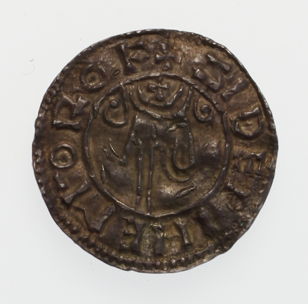 An image of Coinage. Penny. Benediction hand type. Æthelred II (AD 978–1016), ruler. Siduwine, Moneyer. Rochester Mint. Object composed of silver measuring: 1.69 by 20.7 by 270. Inscription: +Ä5ELRED REX 0ÑLO, Obverse; +çIDEæINE MÖ RÖF, Reverse. Production date: CE 978. Medieval, Anglo-Saxon. 