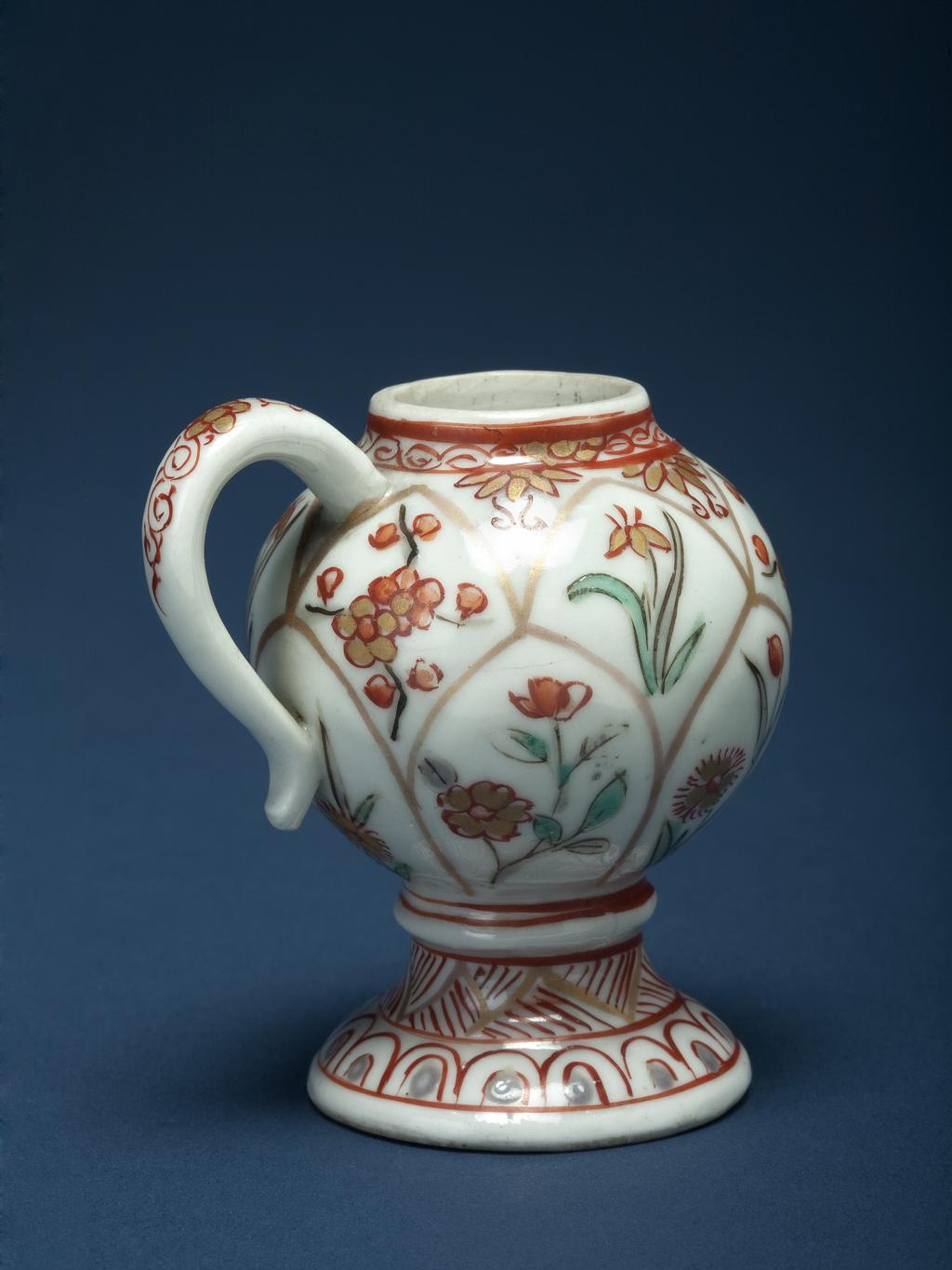 An image of Miniature Mustard Pot. Hard-paste porcelain, moulded in shallow relief tiered petals, decorated with flower sprays in enamels with gold, height 6.1cm, circa 1670-1690. Japanese.