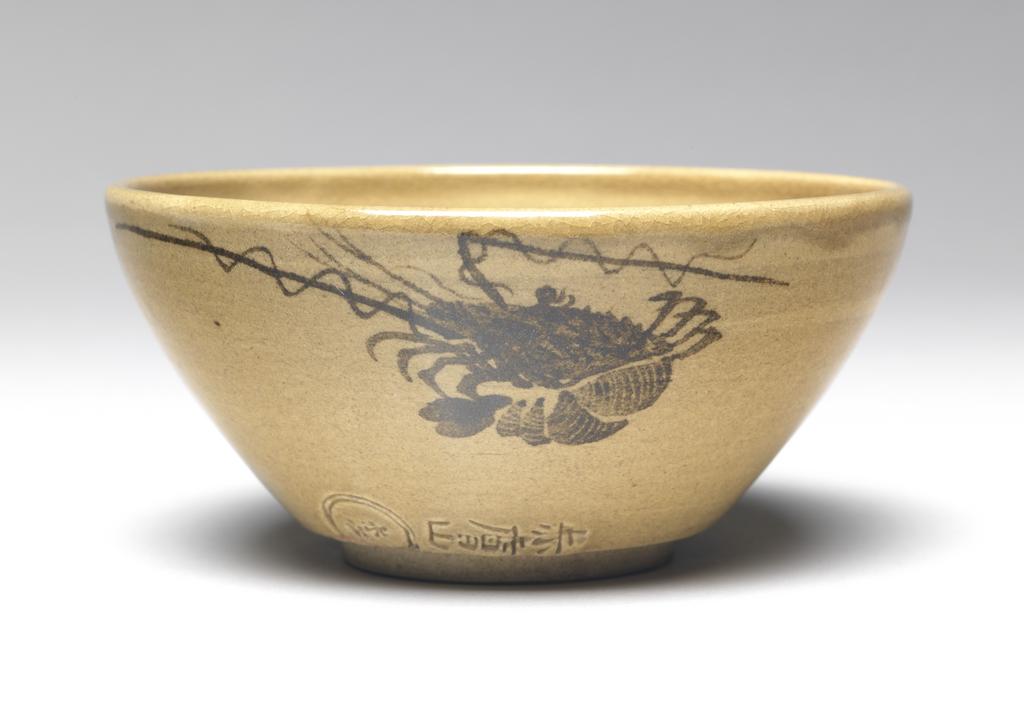 An image of Japanese pottery. Tea bowl. Okuka Mokuhaku (Japanese, 1800-1871). Production Place: Japan, Akahada, Nara. Footed tea bowl, thrown and turned. Buff-coloured ware with clear straw-coloured glaze, decorated with a crayfish in dark brown. Circular hollow in base of well. Thin foot rim. Impressed mark. Stoneware, glazed except foot, brush painted, height, whole, 5.30 cm, diameter, bowl, 11.20 cm, diameter, foot, 4.70 cm, circa 1845- 1871. Edo Period (1615-1868).