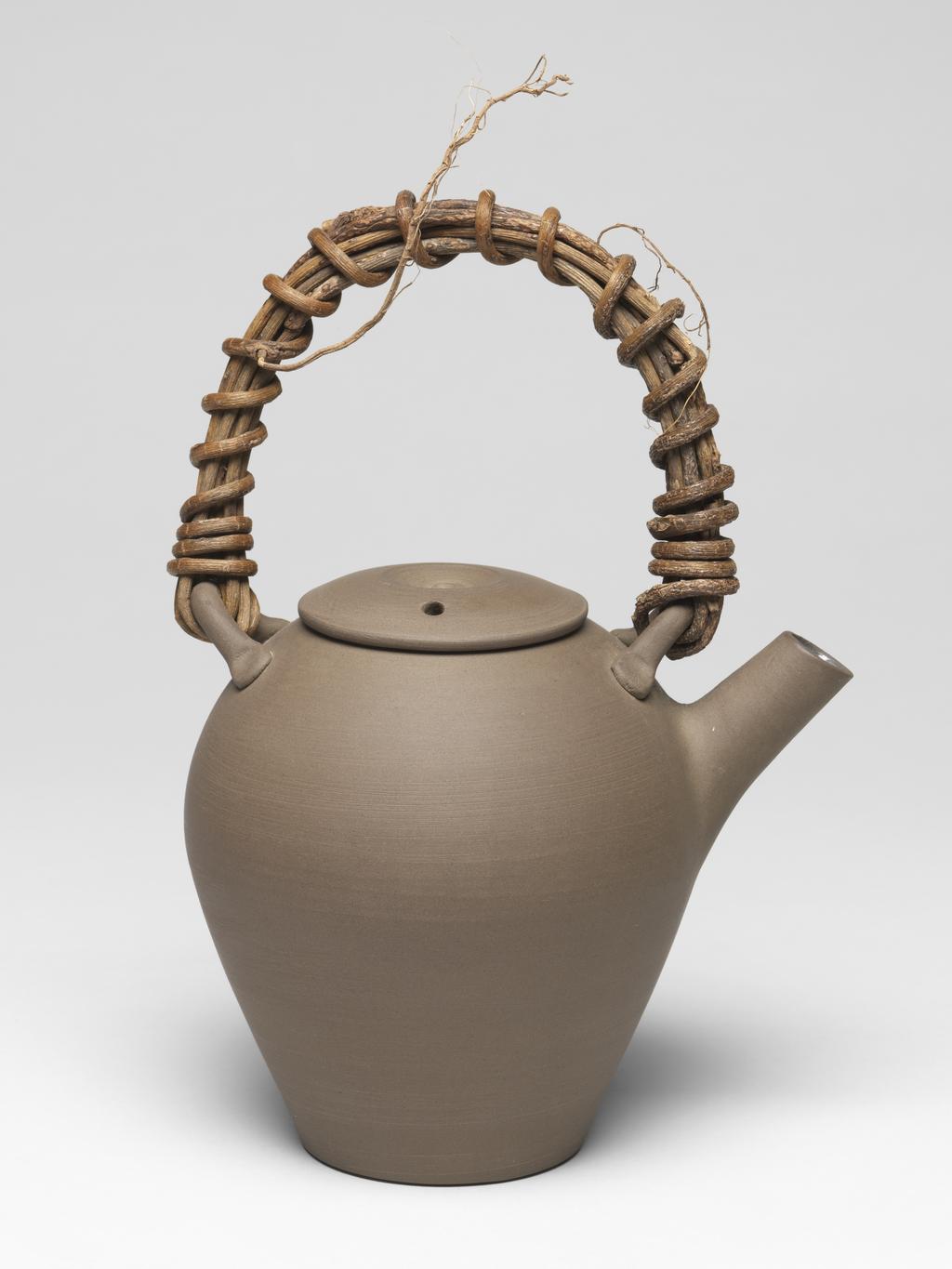 An image of Contemporary Craft. Studio Ceramics. Tea set with two cups (C.22.2 & 3-2002), a tea pot (C.22.1&A-2002), and a ground (tray, C.22.4-2002). Stair, Julian (British, b.1955). 2002. Given by Nicholas and Judith Goodison through the National Art Collections Fund.