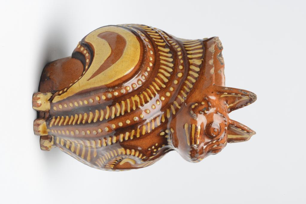 An image of Cat Jug. Vessel in form of a cat. Unknown maker, England, Staffordshire. Lead-glazed earthenware.