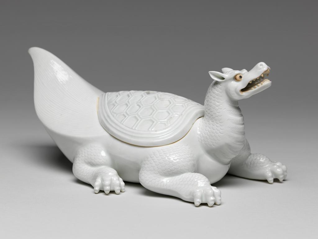 An image of Flaming tortoise, white Hirado. An immortal is missing from the lid. Unknown maker. Hard-paste porcelain, 1750-1780. Edo Period (1615-1868). Acquisition Credit: Given by David Hyatt King, through The Art Fund.