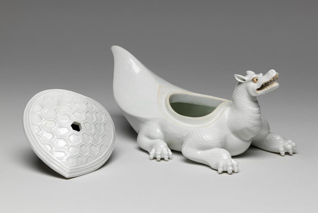 An image of Flaming tortoise, white Hirado. An immortal is missing from the lid. Unknown maker. Hard-paste porcelain, 1750-1780. Edo Period (1615-1868). Acquisition Credit: Given by David Hyatt King, through The Art Fund.