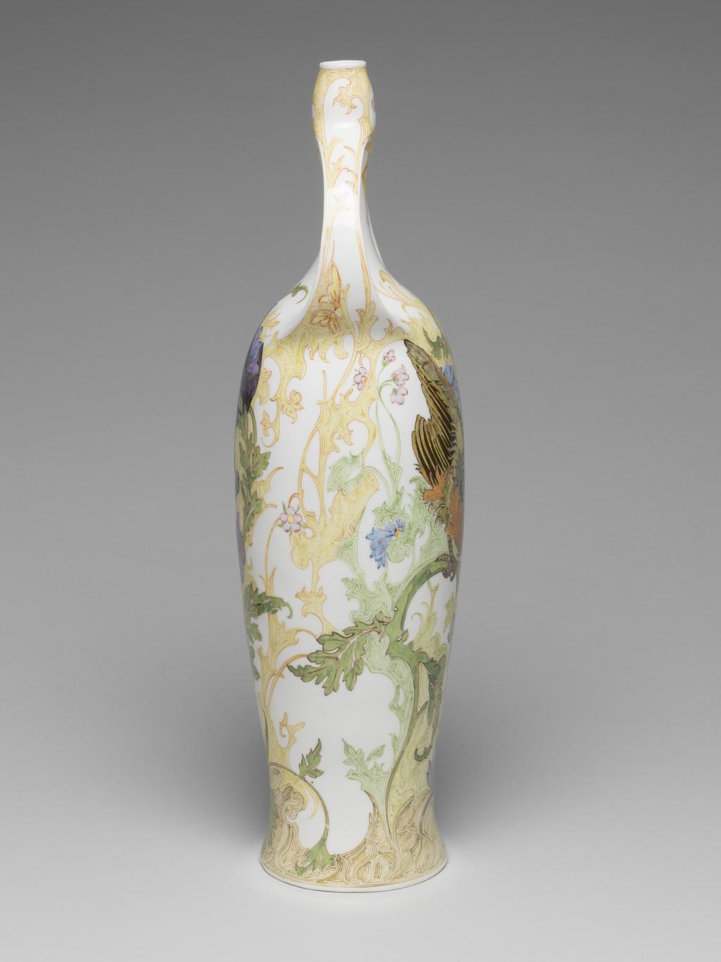 An image of Pair of two-handled balaster vases. Tegel en Fayencefabriek Amphora Factory, Oegstgeest. Designed by J. Jurriaan Kok (Dutch, 1861-1919). Painted by Samuel Schellink (Danish, 1876–1958). C.28-2014: Tall eggshell porcelain vase, baluster shape, hand-painted in polychrome enamels with bird, poppy and foliage motifs in Art Nouveau style. Circular in plan, with tall gently-concave body rising to a long narrow neck, the top of the neck slightly wider than the bottom. Two strap handles, cast with the body, rise from the shoulders and rejoin the vase towards the top of the neck. The overall form suggests an erect female body with arms raised to her head. Decorated with a finely painted flowing floral design. On one side is a green-headed songbird which appears to be flying out of the body. On the other side is a large spray of purple and light blue oriental poppies. Eggshell porcelain, decorated underglaze in polychrome enamels with hand-painted motifs, height 36.5 cm, base width 8.5 cm, circa 1914.C.29-2014: Tall eggshell porcelain vase, baluster shape, hand-painted in polychrome enamels with bird, poppy and foliage motifs in Art Nouveau style. Circular in plan, with tall gently-concave body rising to a long narrow neck, the top of the neck slightly wider than the bottom. Two strap handles, cast with the body, rise from the shoulders and rejoin the vase towards the top of the neck. The overall form suggests an erect female body with arms raised to her head. Decorated with a finely painted flowing floral design. On one side is a black-headed songbird which appears to be flying out of the body. On other side is a large spray of orange oriental poppies. Eggshell porcelain, decorated underglaze in polychrome enamels with hand-painted motifs, height 36.5 cm, base width 8.5 cm, circa 1914.