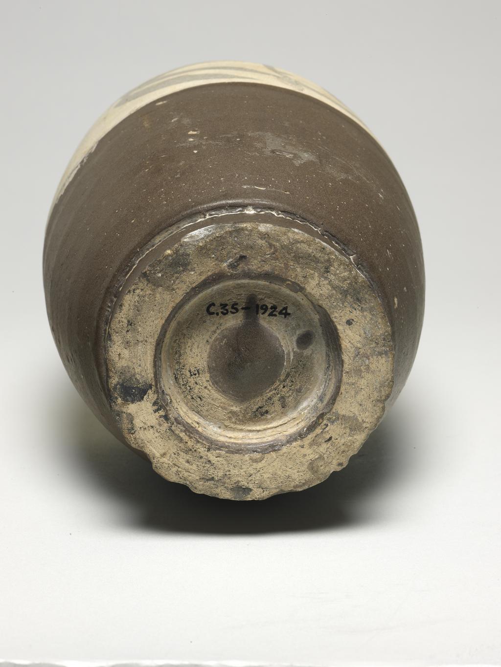 An image of Vase. Cizhou ware/Tzu chou. Unknown production, China. Stoneware vase, with four loop handles. The top part is white over brown scroll decoration, while the lower part is matt brown. Stoneware, height, 30.5, cm, width, 13.3, cm. Song Dynasty (960-1279). Acquisition Credit: Given by Oscar C. Raphael.