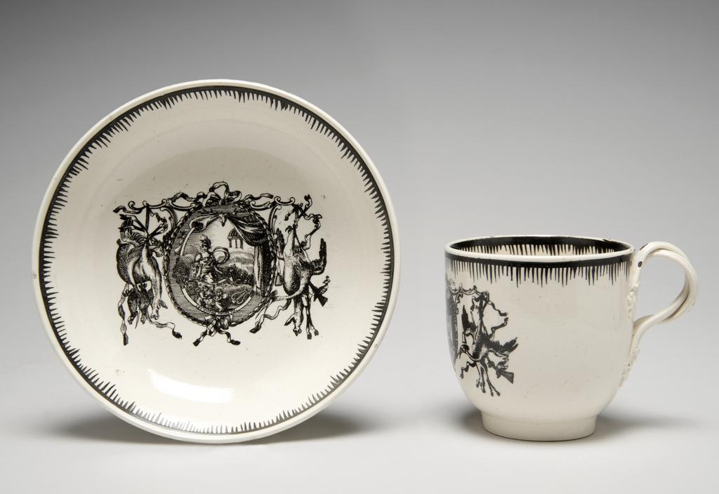 An image of Creamware chocolate cup and saucer, with Minerva and emblems of Wisdom and Industry. Neale & Co., factory, perhaps, Staffordshire. Leeds Pottery, factory, perhaps, Yorkshire. The cup stands on a low footring from which its sides curve outwards and then almost vertically upwards to the rim; reeded double intertwined loop handle with flower and leaf terminals. The saucer has a low footring and deep, concave curving sides. The front of the cup and the centre of the saucer are transfer-printed with a medallion with a medallion enclosing a figure of Minerva, various emblems of Wisdom and Industry and the motto 'LET WISDOM UNITE US', flanked by trophies of game. The interior of the cup is painted with an eight-petalled, stylised flower. Borders on both cup and saucer are composed of a horizontal band from which run close, vertical lines of varying lengths so as to form a rough zig-zag below the band. Cream-coloured earthenware, transfer-printed overglaze and painted in jet black. Pale yellow lead-glaze, inclining towards green where it lies thickly within the footrings. The base and exterior of the cup are lightly crazed with a fine mesh. Height, cup, 6.8 cm, diameter, saucer, 12.6 cm, circa 1780. Rococo.