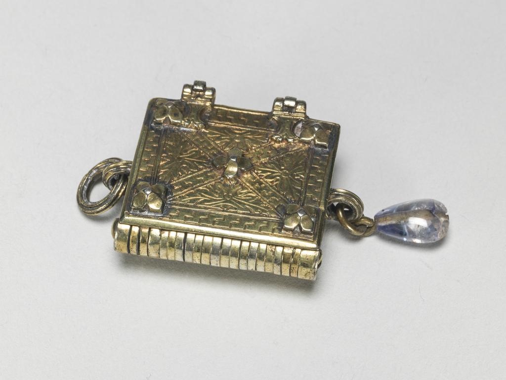 An image of Pendant Book. Jewellery/Pendant. Silver-gilt, with leaves made of silver and engraved with scenes from the Passion. Perhaps for attaching to a rosary, with pendant amethyst. Scenes: Annunciation, Nativity, Last Supper, Agony in the Garden, Kiss of Judas, Christ before Pilate, Scourying of Christ, The Mocking of Christ, Christ Carrying the Cross, the Erection of the Cross, Christ being Nailed to the Cross, the Crucifixion Deposition, Entombment, Resurrection, Christ Child Enthroned, a Pope and a female Saint. Silver-gilt, height, whole, 6.0 cm, width, whole, 2.8 cm, circa 1500- circa 1700. German.