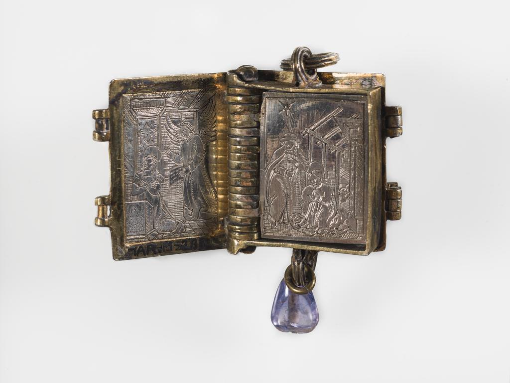 An image of Pendant Book. Jewellery/Pendant. Silver-gilt, with leaves made of silver and engraved with scenes from the Passion. Perhaps for attaching to a rosary, with pendant amethyst. Scenes: Annunciation, Nativity, Last Supper, Agony in the Garden, Kiss of Judas, Christ before Pilate, Scourying of Christ, The Mocking of Christ, Christ Carrying the Cross, the Erection of the Cross, Christ being Nailed to the Cross, the Crucifixion Deposition, Entombment, Resurrection, Christ Child Enthroned, a Pope and a female Saint. Silver-gilt, height, whole, 6.0 cm, width, whole, 2.8 cm, circa 1500- circa 1700. German.