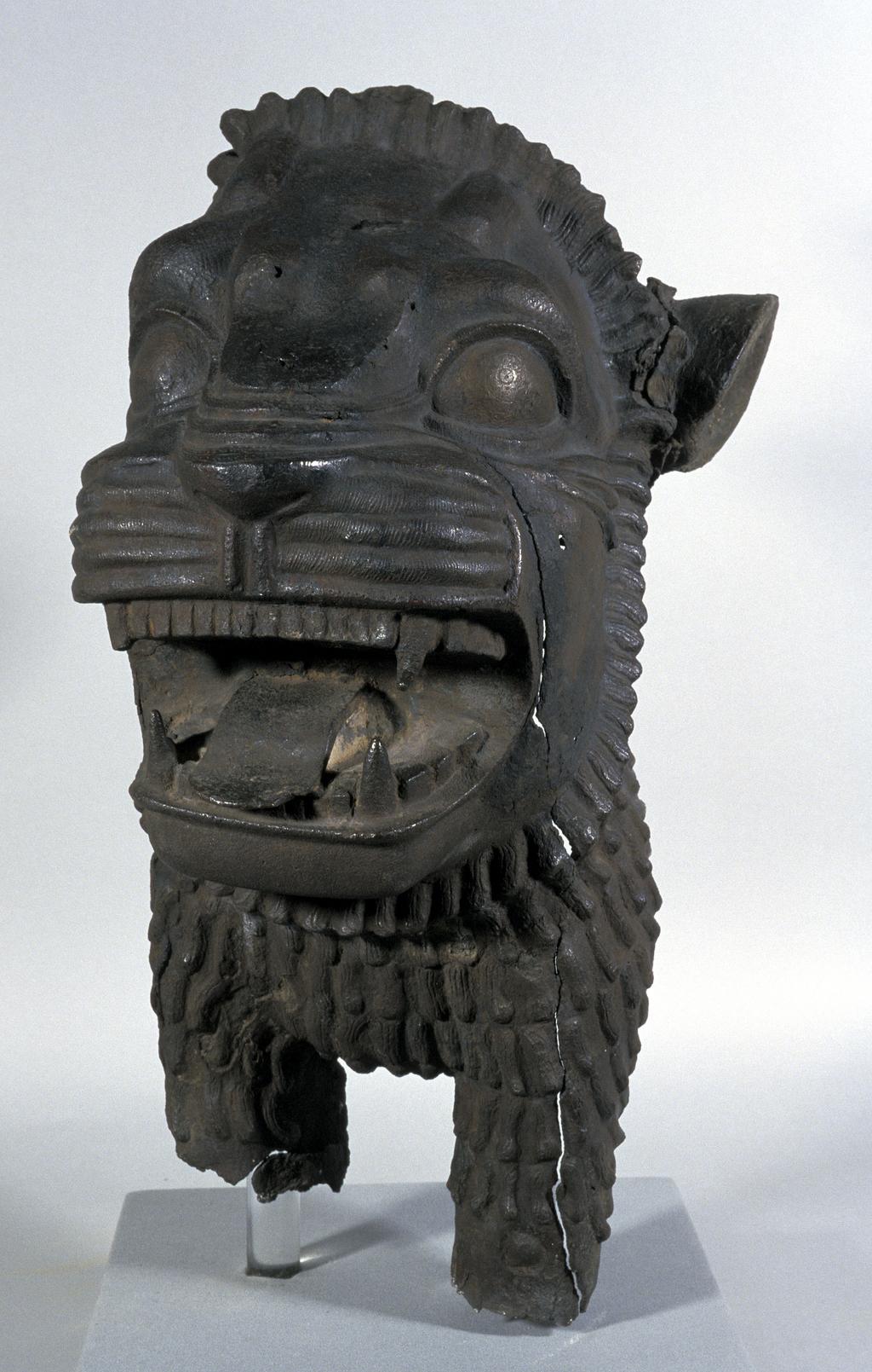 An image of Architectural element/door lintel. Forepart of a hollow cast lion, probably from a door lintel. Find Spot: Shibam? Hadramat, South Arabia. Copper alloy, length 0.556 m, width 0.285 m, circa 800-601 BC.