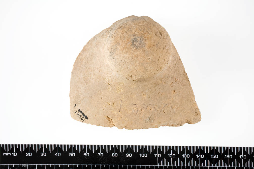 An image of Vessel/Sherd. Fragment, base of large vessel. Production and Find Spot: Tell Kuyunjik (Nineveh), Iraq. Pink clay with straw temper, length 0.06 m, width 0.094 m, 500-1 B.C.