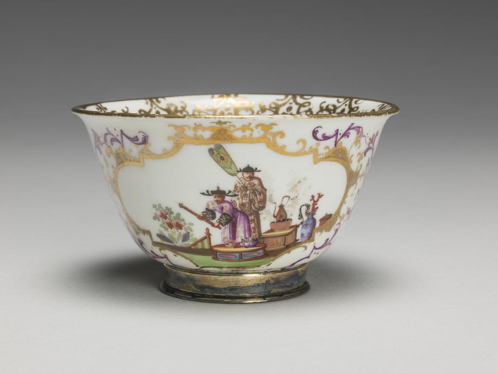 An image of Tea Bowl. Meissen Factory. Hard-paste porcelain painted in enamels with chinoiseries, lustred, and gilt. Circa 1725-1730.