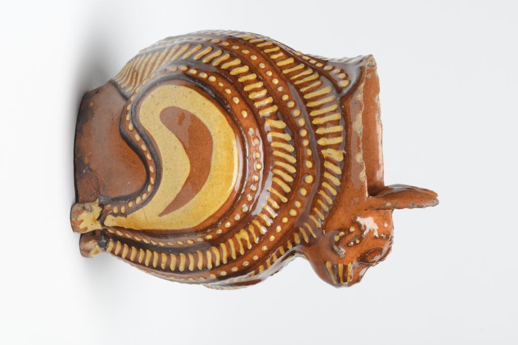 An image of Cat Jug. Vessel in form of a cat. Unknown maker, England, Staffordshire. Lead-glazed earthenware.