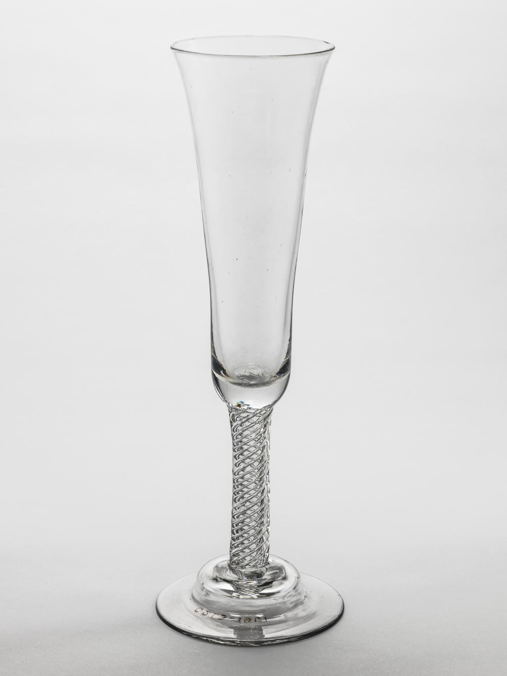 An image of Ale/Champagne Glass/Drinking Glass. Unknown glassmaker, England. Long waisted bowl, air twist stem, domed foot. Lead-glass, bowl blown, height, whole, 28.7 cm, circa 1750.