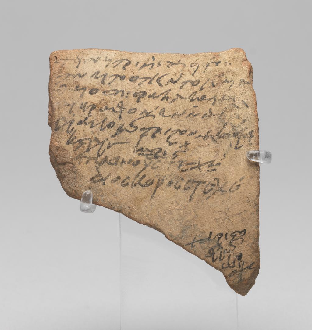 An image of Written document. Ostracon. Fragment of jar, inscribed in 13 lines of Coptic, in black ink. Coptic was an Egyptian language written in a Greek script with added characters. Production Place: Egypt. Find Spot: Medinet Habu (?), Egypt. Ceramic, clay, depth 0.7 cm, length 8.1 cm, width 6.8 cm, approx 730.