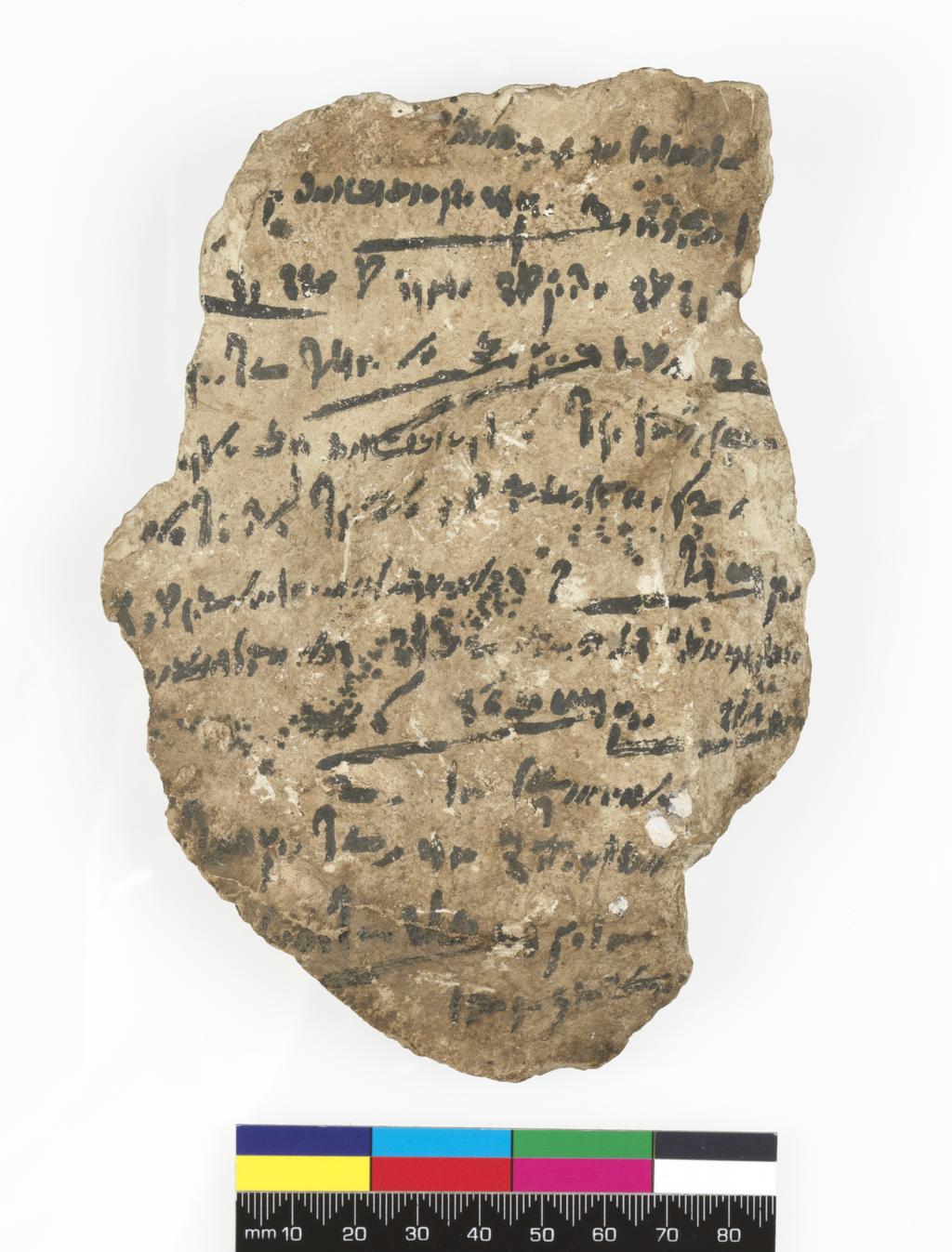 An image of Written document/Ostracon. Demotic text, one side. Production Place/Find Spot: Egypt. Limestone, depth 0.005 m, length 0.162 m, width 0.112 m. Ptolemaic Period.
