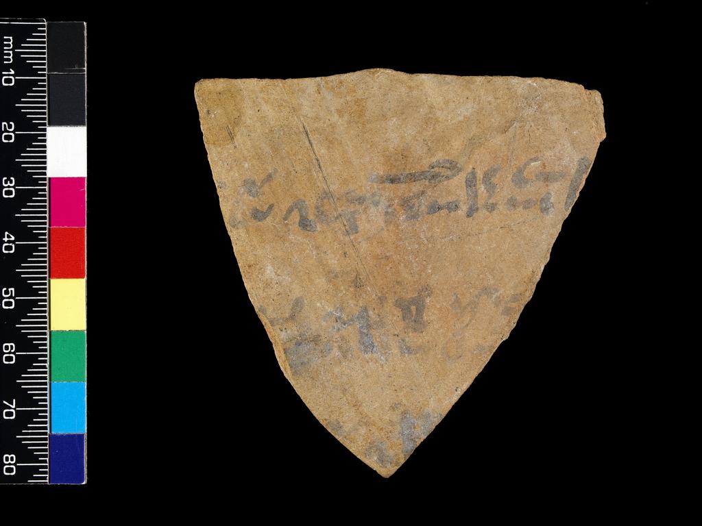 An image of Written Document. Ostracon. Production Place/Find Spot: Egypt. Fragment of jar, with 3 lines of hieratic text in black ink. Depth 0.01 mlength 0.072 m, width 0.057 m.