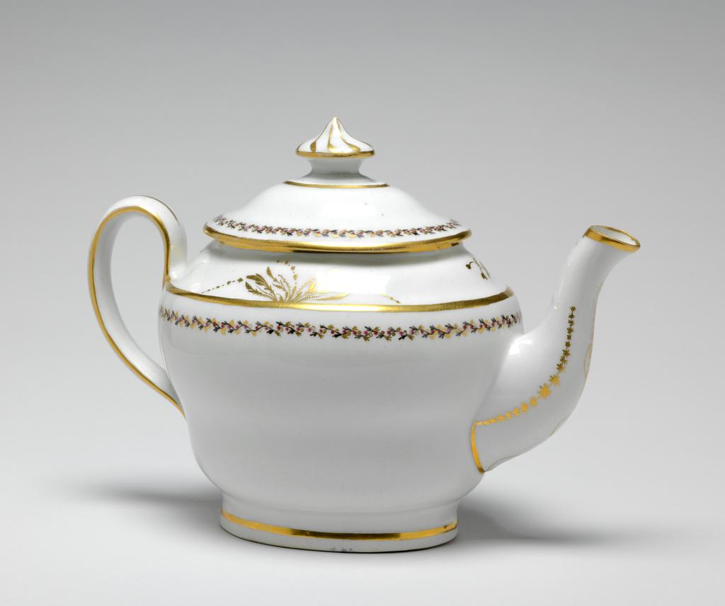 An image of Teapot and stand. New Hall Porcelain Factory, Staffordshire. The teapot and cover (A) are of oval ogee form. The stand (B) is oval with sloping sides and flat base. There are ten holes forming an ellipse surrounding one hole behind the spout, one ventilation hole in the cover, and anothe under the knob. The exterior of the pot is decorated below the shoulder by border comprising a wavy black stem with tiny trefoil leaves, puce berries, and gold trefoil leaves. Above the shoulder there is an an arrangment of gold foliage on each side of the pot and a gold sprig at each end. Gold bands run found the footring, the shoulder, the rim, the sides of the handle, and the tip of the spout. There is a vertical gold line down the back of the handle. Each side of the spout is decorated with a row of gold stars over a line which runs on round its junction with the body. Below the lip there is a gold wavy dotted line over a vertical row of narrow leaves altenating with spots. The cover is decorated en suite, and has eight swirling gold lines radiating from the top of the knob. The stand has a central stylized star-like flower surrounded by an oval gold band, a matching border, and a gold band on the edge. Pattern no. 280. Hybrid hard-paste porcelain, moulded, glazed, painted overglaze with black and puce enamel, and gilded. Height, teapot, 17.5 cm, length, teapot, 24.2 cm, height, stand, 2 cm, length, stand, 17.7 cm, width, stand, 14.6 cm, circa 1797-1803.