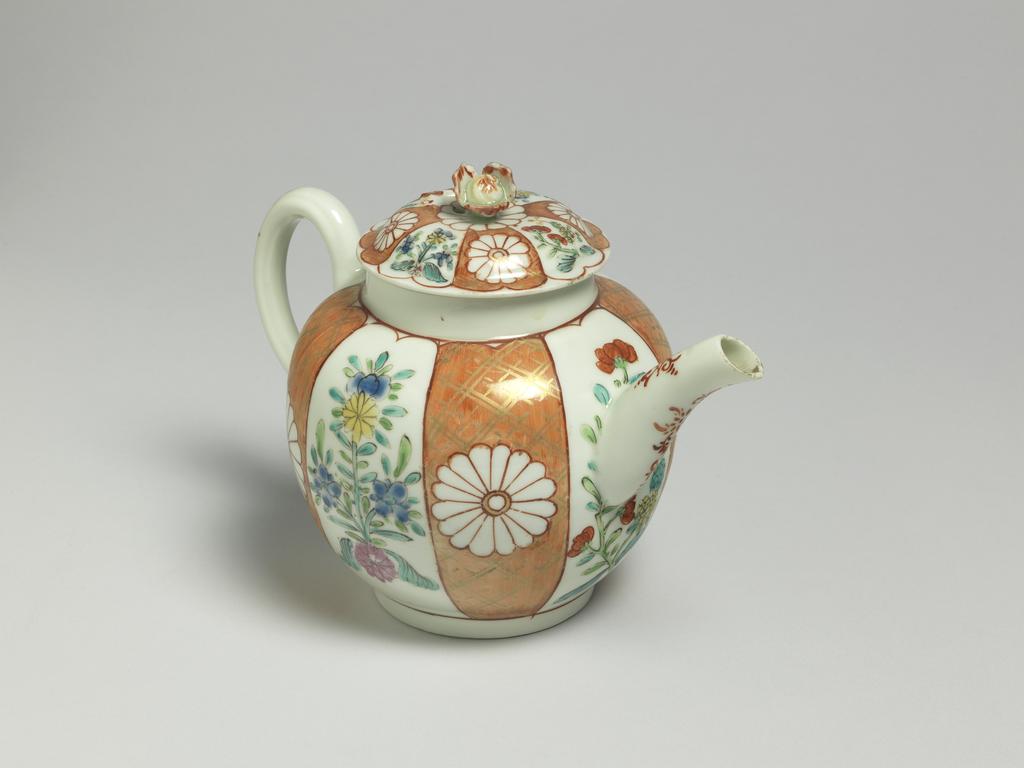 An image of Teapot and cover. Worcester Porcelain Factory. Giles, James, probably (British porcelain painter, 1718-1780, London). The globular teapot has a curved spout and ribbed loop handle, and a low footring. The slightly domed cover has a flower knob. The sides of the teapot are painted, probably in the atelier of James Giles, with a Japanese pattern, with four upright orange-ground panels with gilt trelliswork, each with a chrysanthemum head mons in reserve, separated by four flower sprays in famille-rose style. The handle and spout have a rococo motif in red. The cover is painted in en suite. Soft-paste porcelain, lead glazed, painted in orange, red, yellow, green, blue and pink enamels, and gilt, height, whole, 14.0 cm, length, whole, 19.3 cm, circa 1765-1768. Japanese Style.