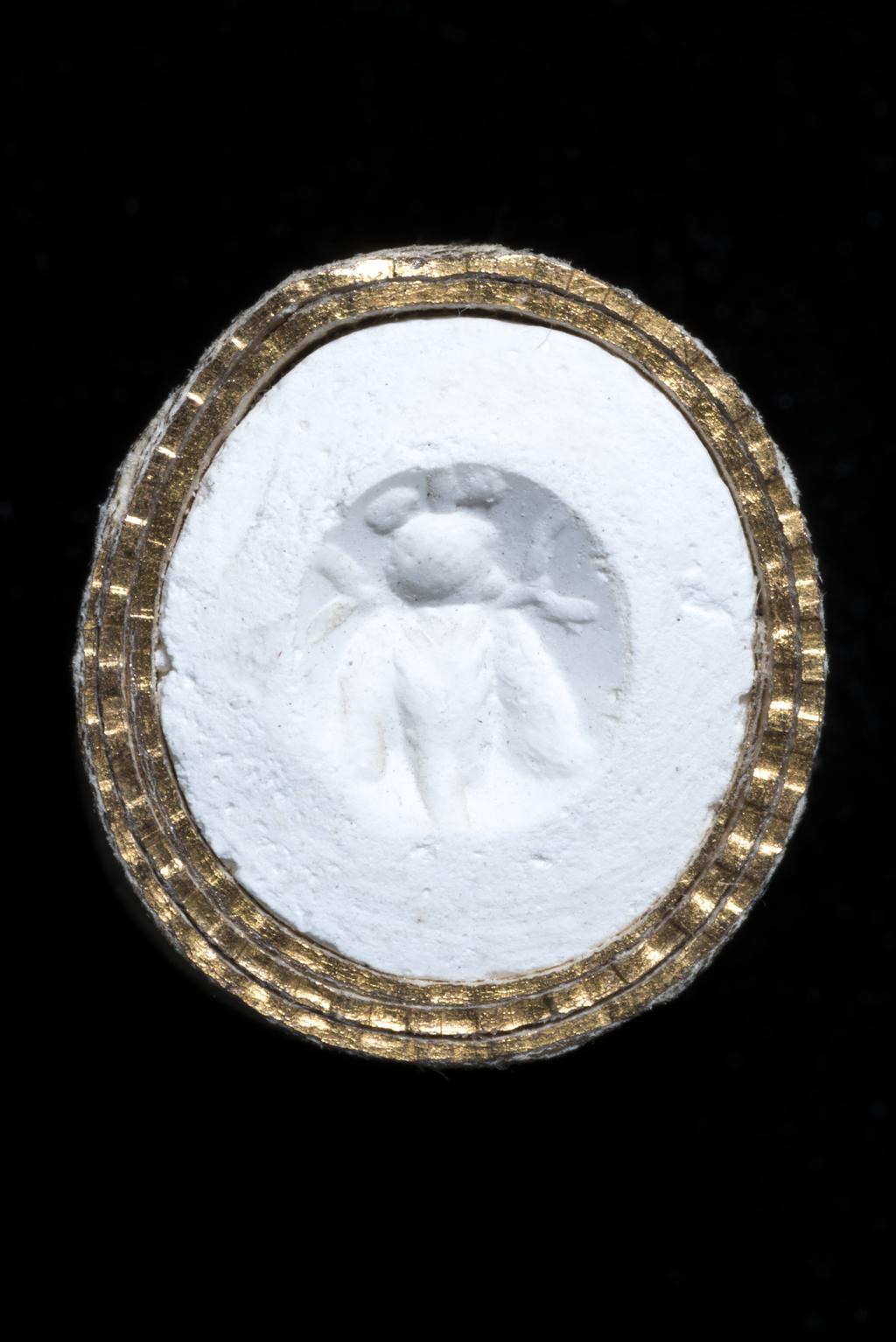 An image of Engraved gems/Ringstone. A cicada with large head and bullet-shaped body; wings by its side. Intaglio cutting, plasma, 6 mm x 5 mm, circa 0-circa 100 AD. Roman Imperial.