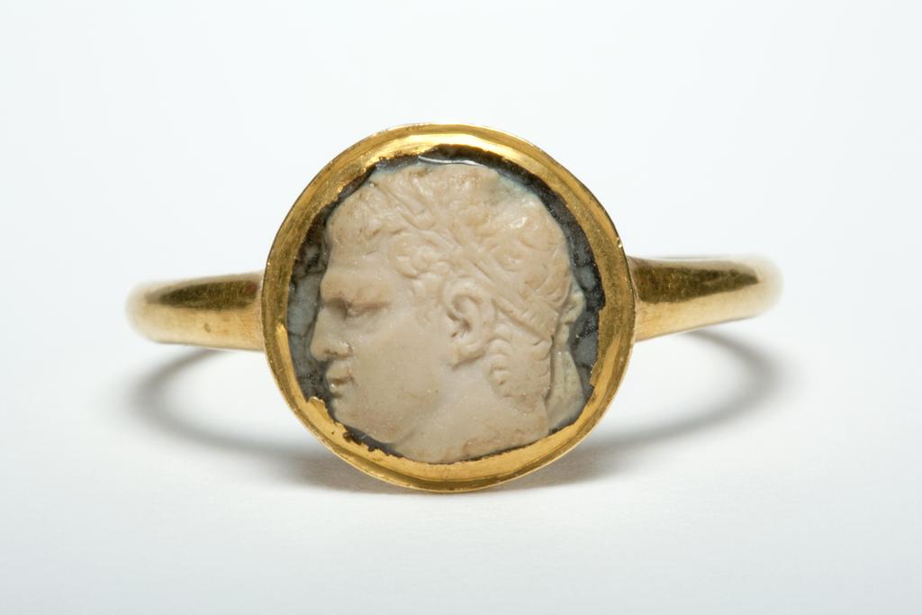 An image of Engraved Gem. Cameo/Intaglio. Head of Agrippa (d.12 B.C.) in profile to the left. He has a high brow, deep-set eyes and an intense expression upon his face. His hair is waved in the usual Julio-Claudian manner and he has a rostral crown around his brows. Onyx, 9.5 x 9.5 mm, 20 BC- 0 AD. Augustan. Roman Imperial.
