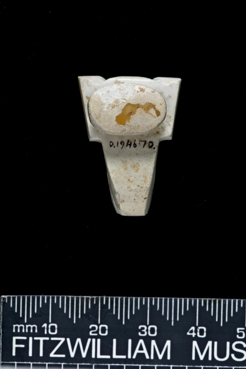 An image of Belt Hook. White jade with areas altered to opaque white, carved with a winged-body. A broad neck narrows to the hook, which terminates in a bird head. On the undecorated underside is a small oval stud. Nephrite, height 1.8 cm, length 2.9 cm, 400-200 B.C. Chinese.