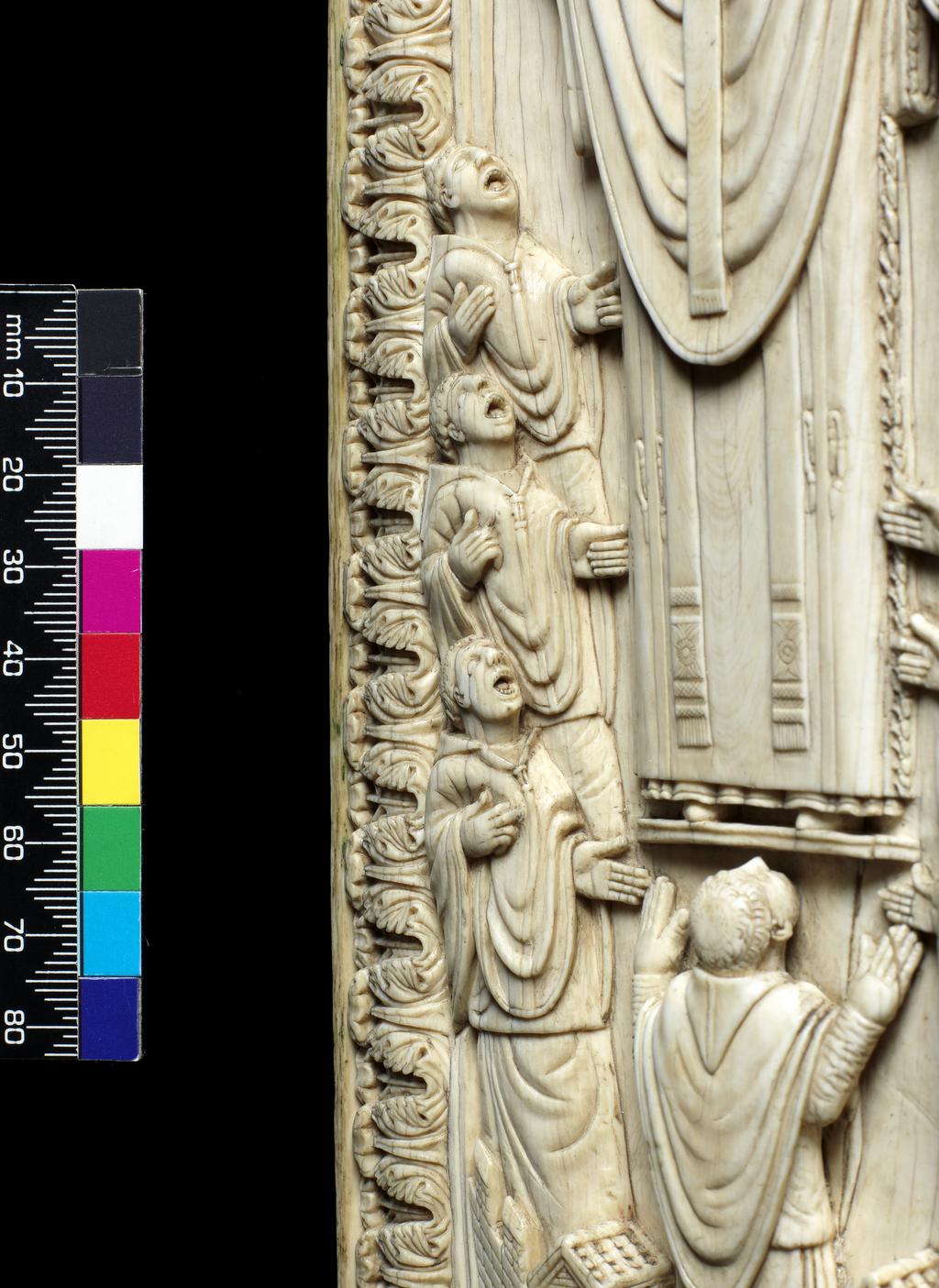 An image of Sculpture. An Archbishop among his Choir. Ivory, carved, height (whole) 33.7 cm, width (whole) 11.4 cm, depth (whole) 1.2 cm, circa 950 to 1000. Unknown, maker, probably, Lotharingia.