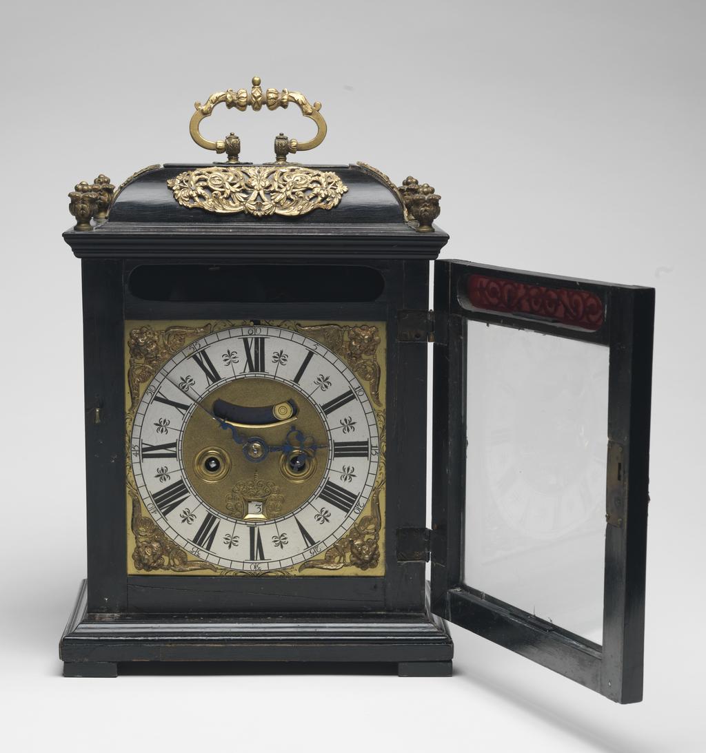 An image of Table Clock. Gould, Christopher, maker of movement (British, London). An 8-day ebony table clock with back plate inscribed 'CHRISTOPHER GOULD LONDON'. Height, case, 37 cm, circa 1695. Production Note: Reconverted early twentieth century to verge with later back-cock.