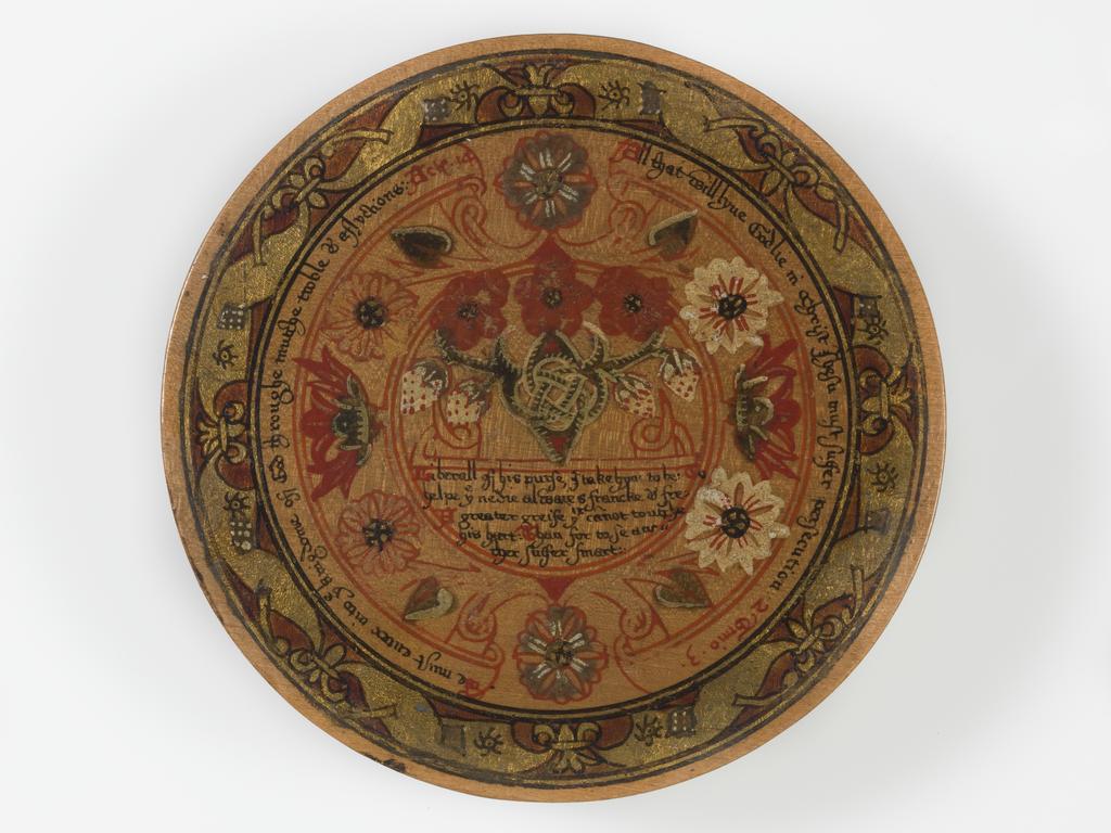 An image of Woodwork. Box of roundells. Box containing twelve trenchers. Wood, painted, gold decoration, height, box, 3.2 cm, diameter, box, 16.6 cm, diameter, roundels, 13.2 cm, circa 1600. Renaissance. Elizabeth I. English.