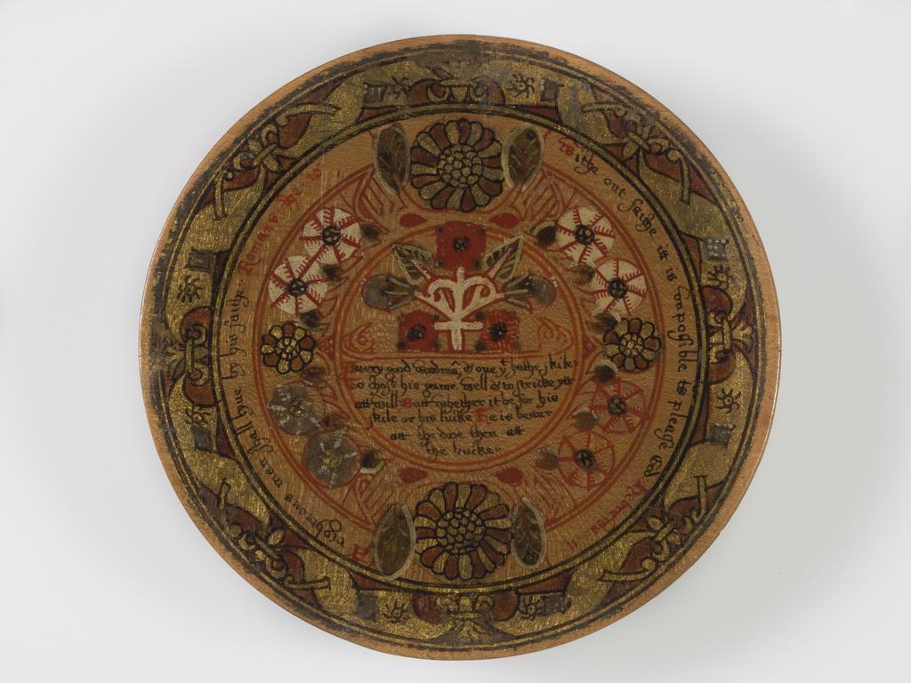 An image of Woodwork. Box of roundells. Box containing twelve trenchers. Wood, painted, gold decoration, height, box, 3.2 cm, diameter, box, 16.6 cm, diameter, roundels, 13.2 cm, circa 1600. Renaissance. Elizabeth I. English.